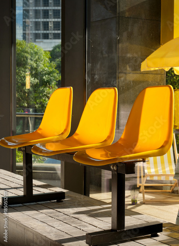 yellow plastic seats in a playground