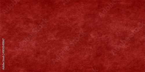 A dark and rough red grunge paper texture features a vintage textured pattern with a weathered material surface, creating an old blank canvas backdrop for a rustic wallpaper design