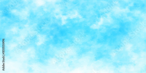 A beautiful clear blue sky with bright white clouds creates a natural summer landscape and a sunny atmosphere for a peaceful heavenly cloudscape