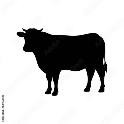 Black Silhouette of a Cow Standing Profile with Curved Horns and Tail