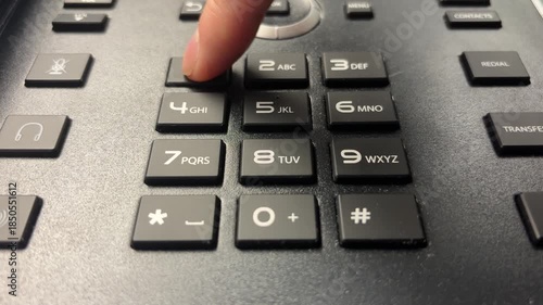 Slow Motion Close-Up of Index Finger Dialing 9-1-1 on Push-Button Phone