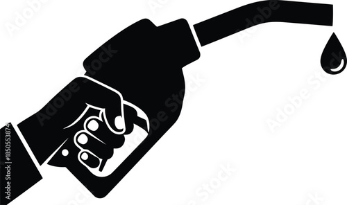 Hand holding black gas pump nozzle with dripping fuel