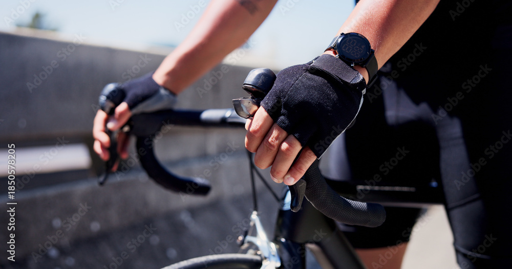 Obraz premium Cycling, hands and athlete on bicycle, city or practice competition on urban road, fitness or active. Outdoor, cyclist and person on bike for sport tournament, training and eco friendly transport