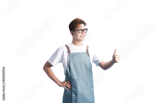 Φωτογραφία Cheerful Aproned Professional: An upbeat individual, sporting an apron and glasses, beams with confidence and approval, offering a gesture of positivity
