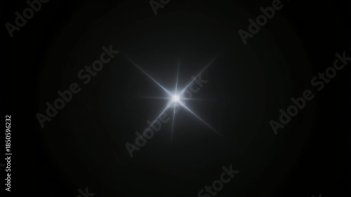 Brilliant digital lens flare creating a starburst effect against a dark background, an abstract light phenomenon perfect for graphic design and atmospheric overlays