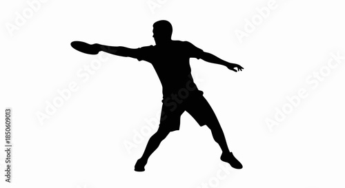 Silhouette of a person playing frisbee.