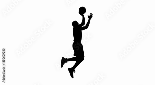 Silhouette of a basketball player in action.