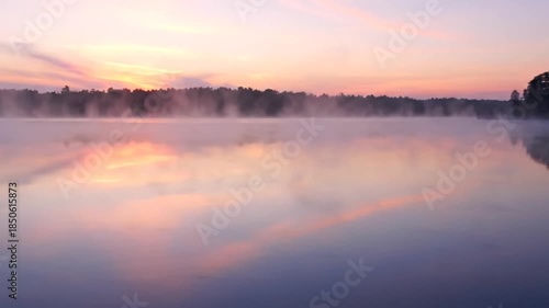 Wallpaper Mural Serene misty lake at sunrise with pastel sky reflections tranquil nature scene Torontodigital.ca