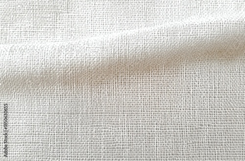 close-up of white woven gauze fabric with soft fold and subtle shadow, calm minimalist textile texture