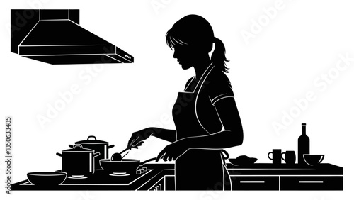 Silhouette of a woman cooking preparing a meal at the stove with pots and pans under a range hood