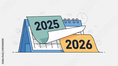 Calendar pages turning from 2025 to 2026 on a desk viewed from a slight angle