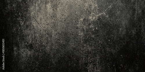 An abstract textured surface with a grunge or distressed look mostly dark gray, and light gray background in graphic design, web design.