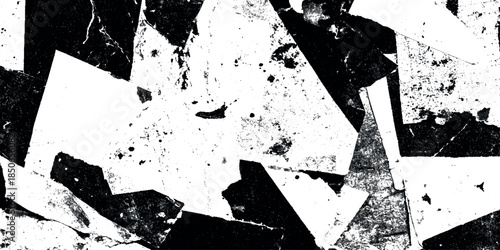 Abstract black ink splatter paper grunge texture with irregular shards a clean white background.