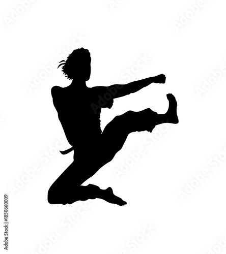 Graceful Female Martial Artist Performing a High Flying Kick in an Athletic Pose on an Isolated White Background