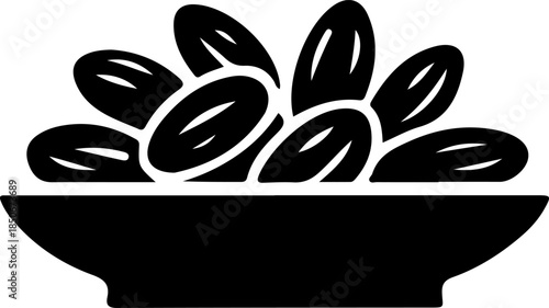 Black silhouette of sweet dates fruit in a bowl isolated for Ramadan iftar and healthy food