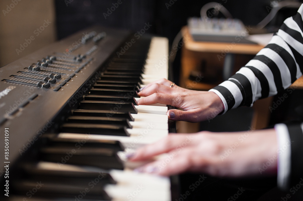Fototapeta premium Hands music, synthesizer, piano