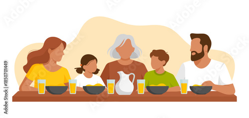 A cheerful family of five sits around a beautifully set table filled with a variety of dishes and drinks, capturing the joy of shared meals and family gatherings.