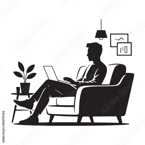 Man working on laptop in comfortable chair