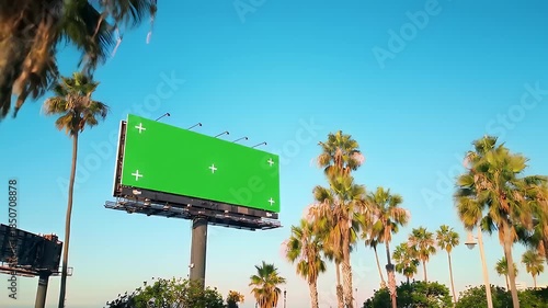 Wallpaper Mural Green Screen Billboard Surrounded by Palm Trees Under a Clear Blue Sky. Torontodigital.ca