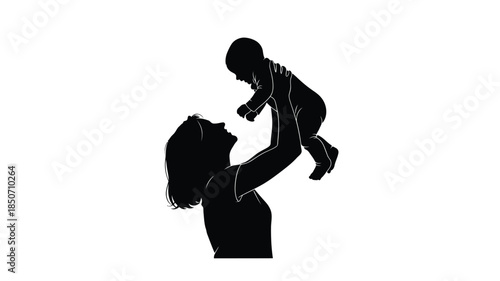 A silhouette of a mother playfully lifting her baby in the air