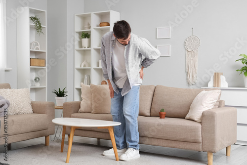 Young man with hemorrhoids ...