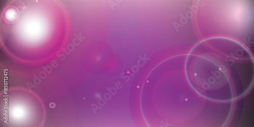 Abstract purple and pink bokeh background with lens flares.