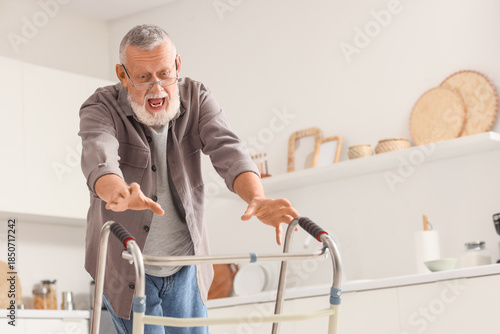 Senior man with walker fall...
