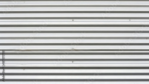 Close-up of a metal shutter with horizontal slats on a white background.
