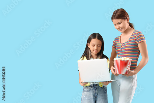 Cute Asian sisters with pop...
