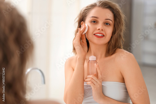 Beautiful woman with bottle...
