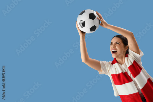 Female soccer fan with ball...