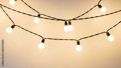 Warm glowing string lights illuminating a soft background, creating a cozy and inviting atmosphere.
