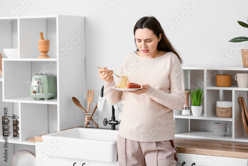 Young pregnant woman suffer...