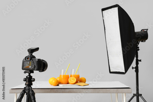 Oranges with juice on table...