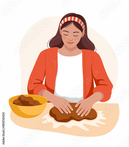 A woman contentedly kneads dough at her kitchen table, radiating warmth and homey vibes, showcasing the joy of cooking and the comfort of homemade food.