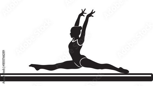 Young woman performing split yoga pose on mat