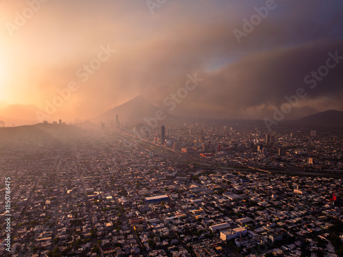 Aerial view of Monterrey City skyline obscured by dry season brush fire haze