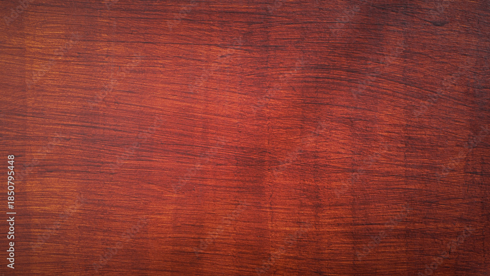 Fototapeta premium Reddish brown wood texture background, polished wooden surface with natural grain pattern for interior design.