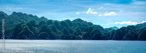 Breathtaking sea and lansdcapes with stunning rock formations covered in lush tropical vegetation surrounded by turquoise waters and coral reefs, Coron, Palawan, Philippines