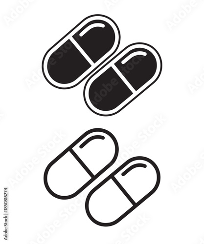 A black and white vector icon illustration of two medicine capsules for healthcare and pharmacy design