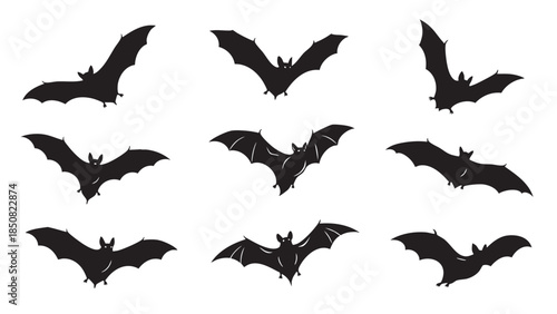 Collection of silhouetted bats flying and hanging with wings spread on transparent background