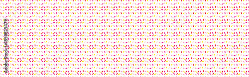 Seamless pattern of small colorful confetti sprinkles in pink yellow and red scattered on a clean white background representing celebration party and festive moments