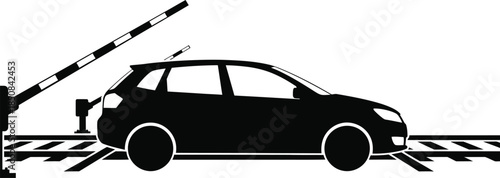 Silhouette of a car stopped at a railway crossing