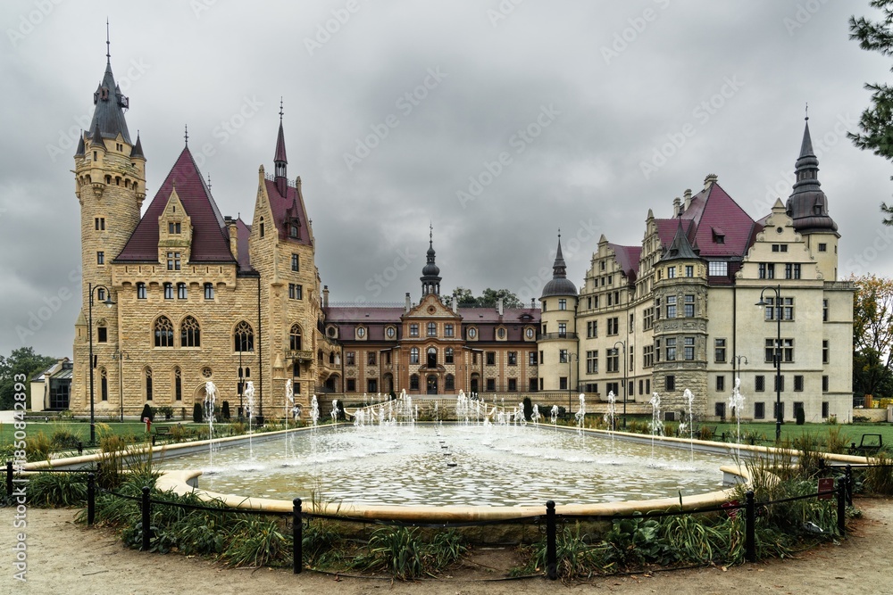 Naklejka premium view of the fairy-tale Mozna Castle and fountains and gardens in southwestern Poland