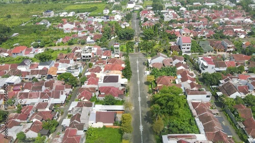 Panoramic aerial view of a sprawling suburban residential area with a mountain in the background.