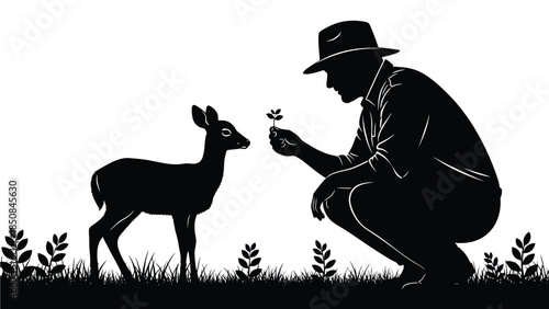 A farmer offering a seedling to a curious fawn 