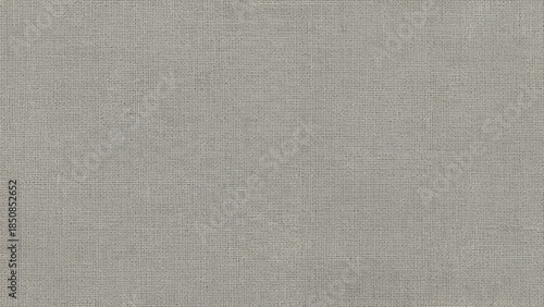 A close-up, full-frame view of a textured, light gray woven fabric surface.