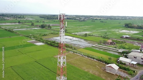 Side moving camera panning left on communication tower