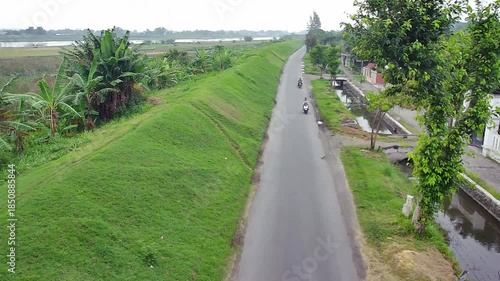 Forward moving camera as rider passes by