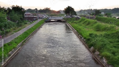 Drone forward flight over flowing river water